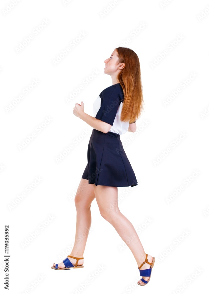 back view of running woman in dress. beautiful redhead girl in motion. backside view of person. Rear view people collection. Isolated over white background. back view of running woman in dress. beautiful redhead girl in motion. backside view of person. Rear view people collection. Isolated over white background.