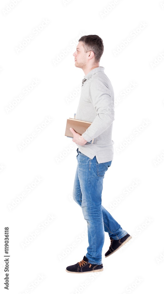 man goes and has a stack of books. back view. Rear view people collection. backside view of person. Isolated over white background. man goes and has a stack of books. back view. Rear view people collection. backside view of person. Isolated over white background.