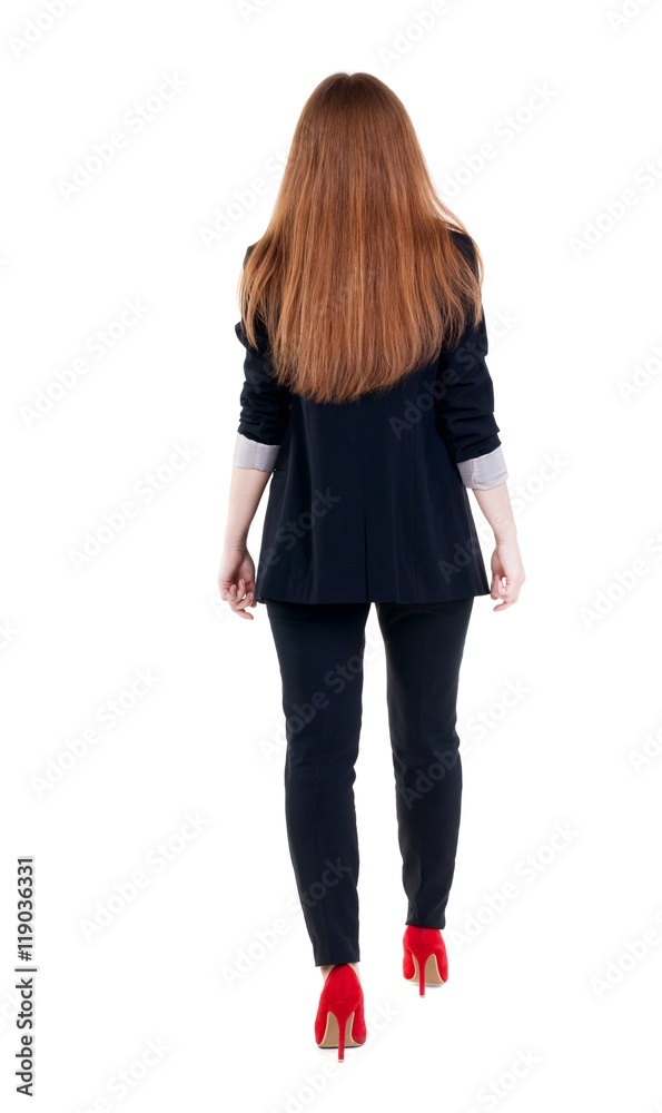 walking red head business woman. back view. going young girl in suit. Rear view people collection. back side view of person. Isolated over white background. walking red head business woman. back view. going young girl in suit. Rear view people collection. back side view of person. Isolated over white background.