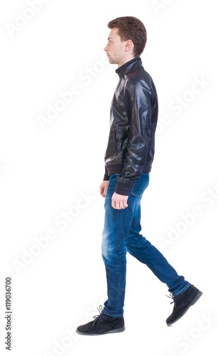 Back view of going handsome man in jacket. walking young guy . Rear view people collection. backside view of person. Isolated over white background. Sad guy in the leather jacket goes to the right