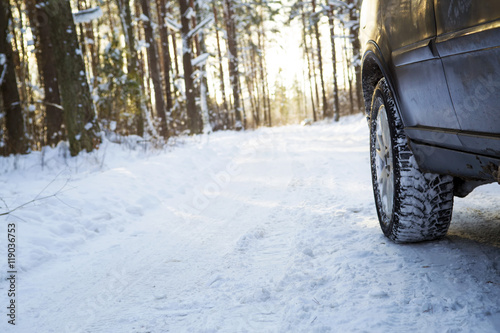 Car on the winter road in the wood. Winter tires © katrin_timoff