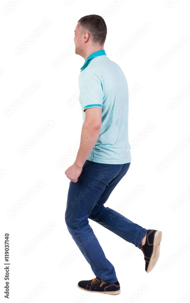 Back view of running man in blue polo. Walking guy in motion. Rear view people collection. Backside view of person. Isolated over white background. Back view of running man in blue polo. Walking guy in motion. Rear view people collection. Backside view of person. Isolated over white background.
