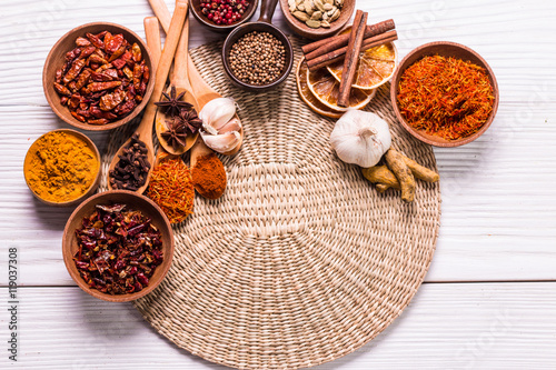 spices and herbs on wooden table.
