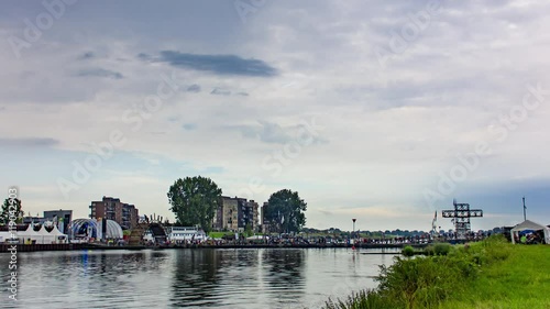 Crowd of people crossing a military pontoon bridge during the four-days marches Nijmegen (Vierdaagse), Netherlands, 4K time lapse photo