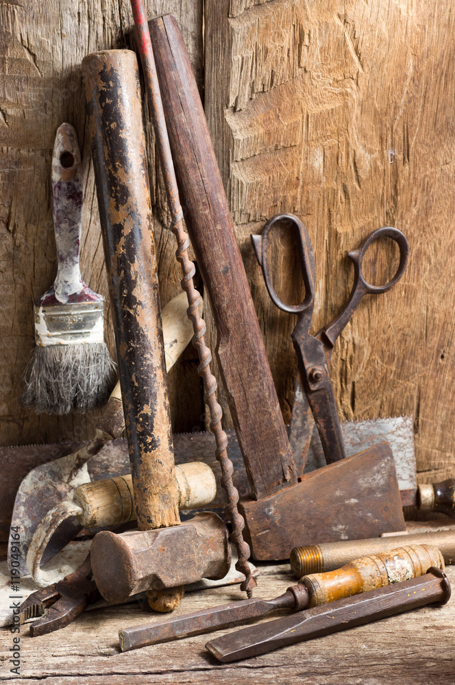 Still life photography : various working tools on old wood background Still life photography : various working tools on old wood background