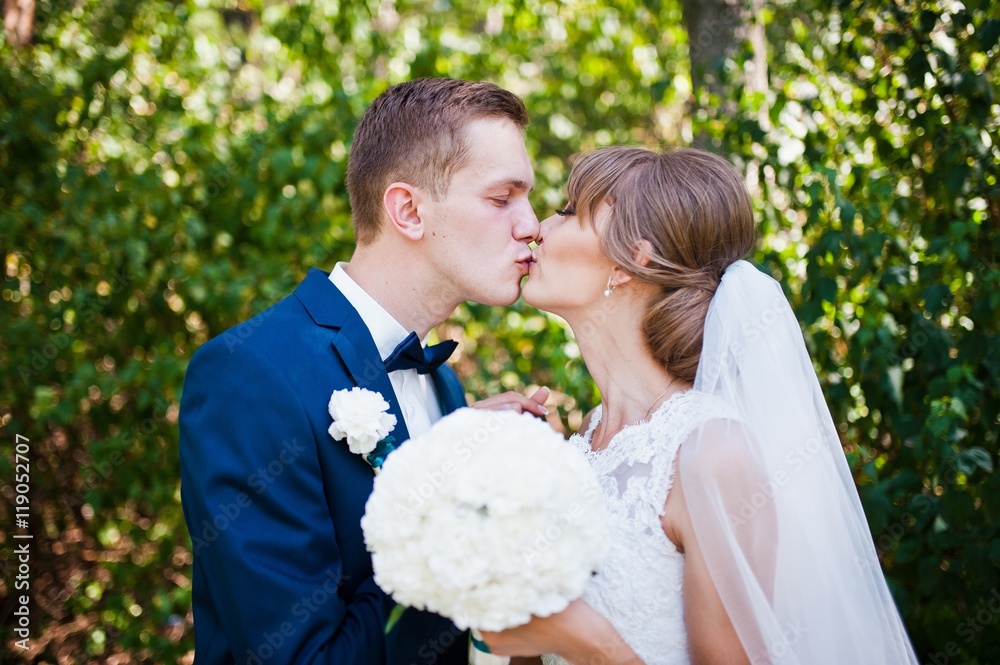 Lovely wedding couple at sunny day on pine wood forest Lovely wedding couple at sunny day on pine wood forest