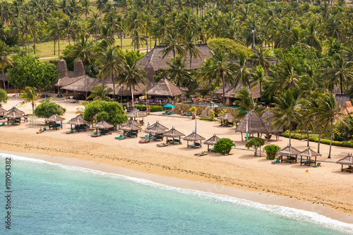 Tropical resort on Kuta sand beach, Lombok, Indonesia photo