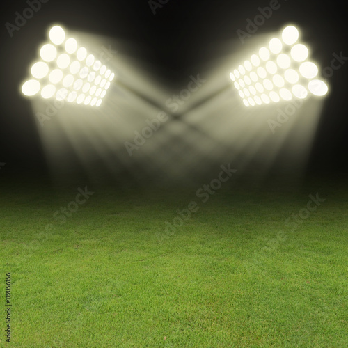 Green soccer field, bright spotlights © foxaon