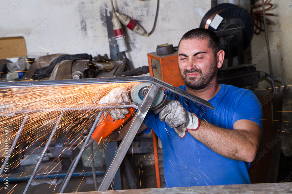 metalworker at work in his workshop metalworker at work in his workshop