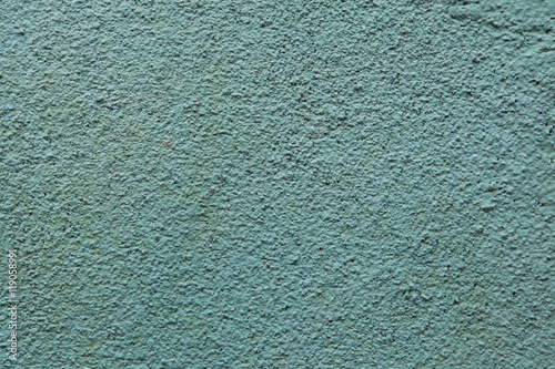 Green painted stucco wall. Background texture