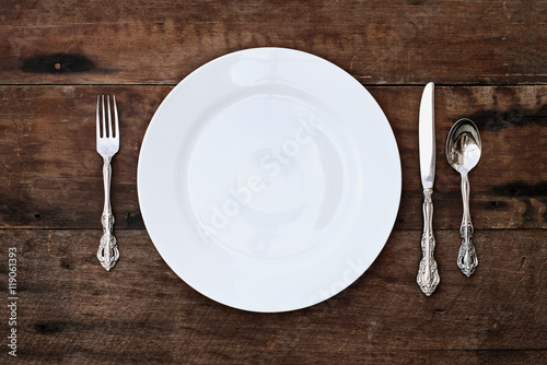 Place setting of a dining set over rustic background