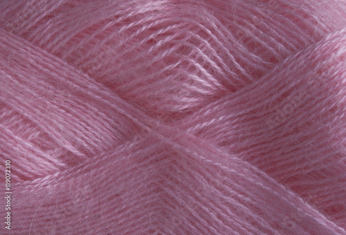 Background of pink wool. Yarn mohair