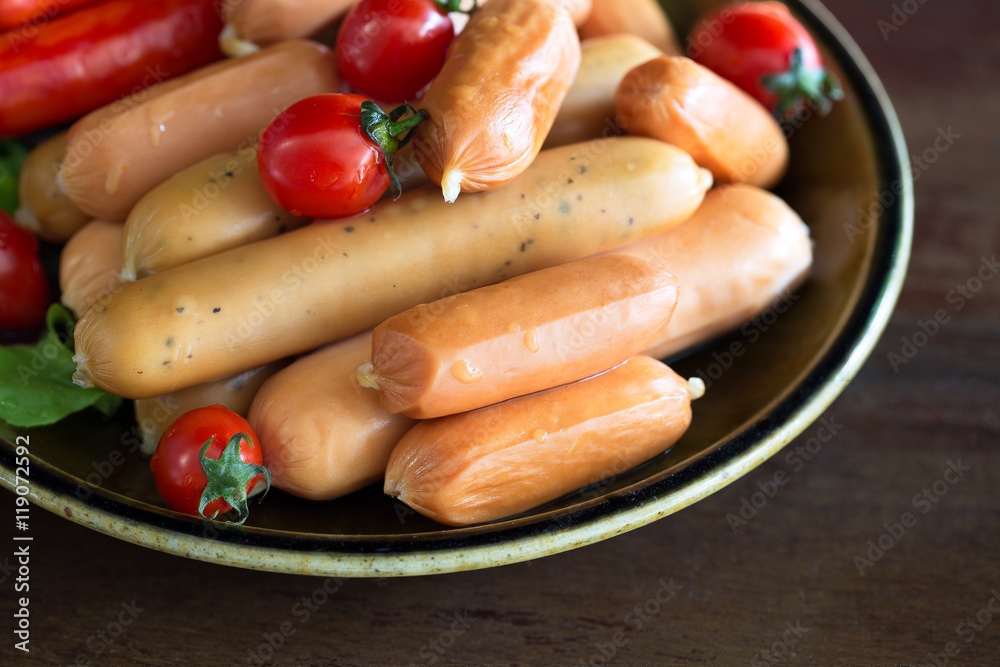 Many fresh sausage and tomato in the dish Many fresh sausage and tomato in the dish