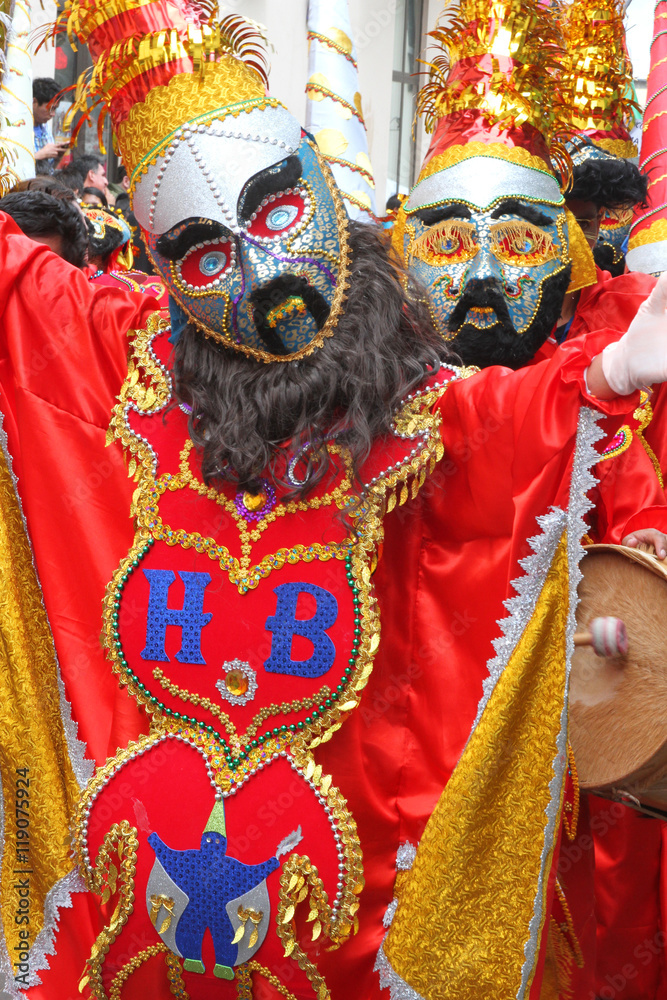 Red Masked Figures in Carnival Parade