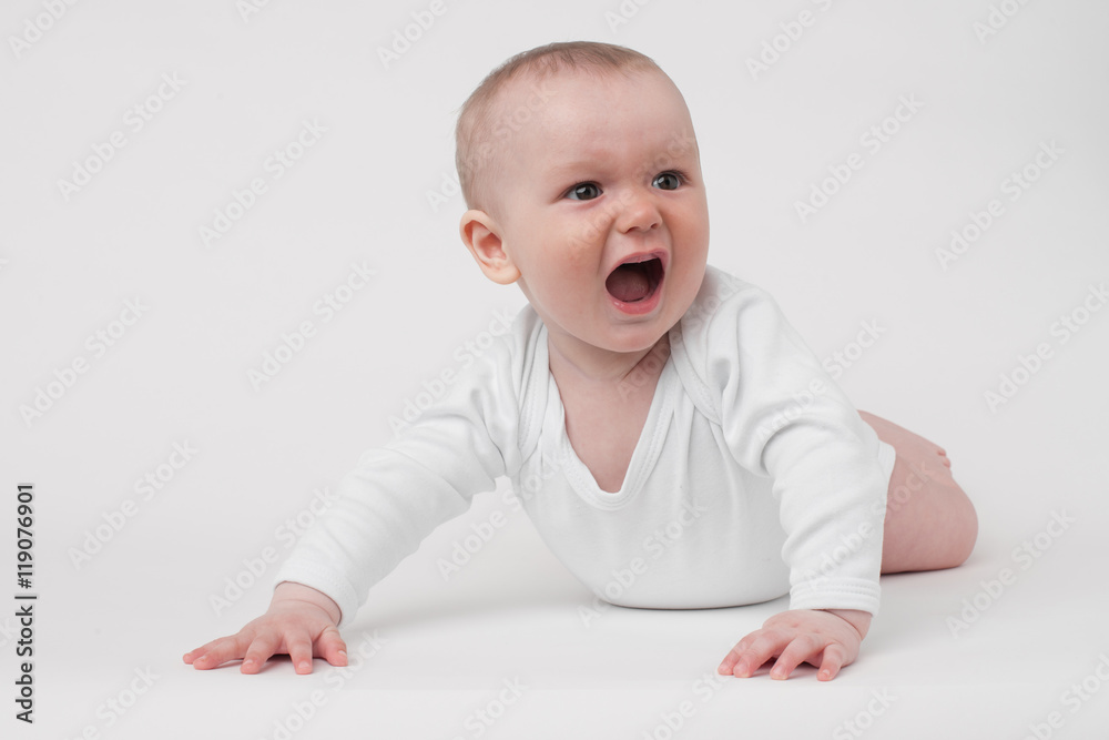 baby on a white background in a white pajamas baby on a white background in a white pajamas