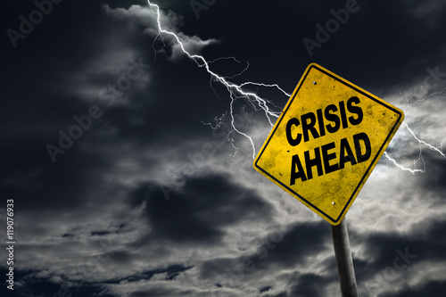 Crisis Ahead Sign With Stormy Background photo