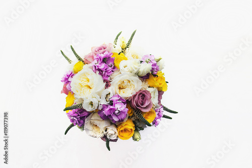 Bridal bouquet of white rose in bright colors isolated on white © EdNurg