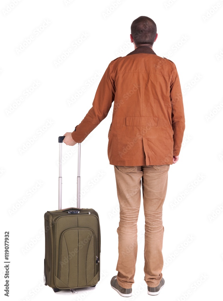 Back view of stylishly dressed man in a brown jackett with suitcase looking up. Standing young guy in jeans and jacket. Rear view people collection. backside view of person. Isolated over white Back view of stylishly dressed man in a brown jackett with suitcase looking up. Standing young guy in jeans and jacket. Rear view people collection. backside view of person. Isolated over white