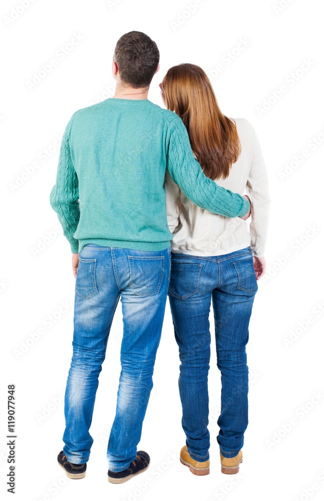 Back view of young embracing couple (man and woman) hug and look into the distance. beautiful friendly girl and guy together. Rear view people collection. backside view of person. Isolated over Back view of young embracing couple (man and woman) hug and look into the distance. beautiful friendly girl and guy together. Rear view people collection. backside view of person. Isolated over