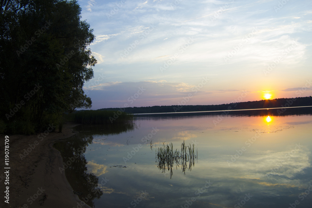 Sunset on the Volga river, the sun sets over the horizon