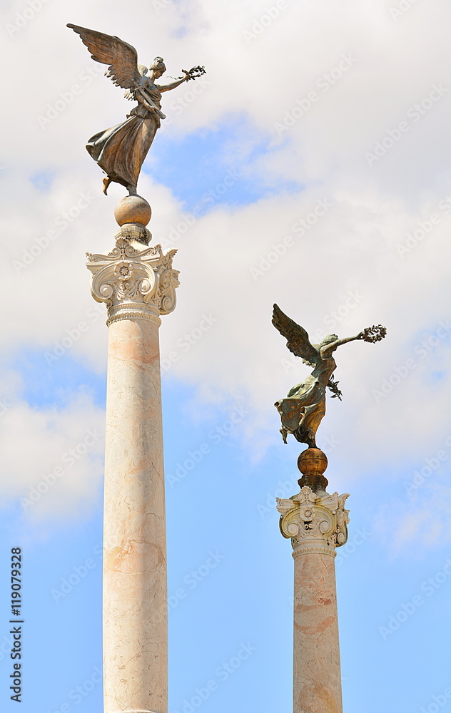 Bronze statue of the goddess of victory on the monument to the memory of Rome, Italy