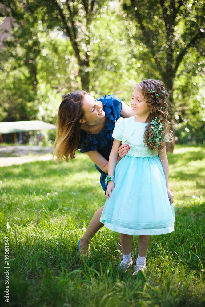 Happy mother and daughter together outdoors Happy mother and daughter together outdoors