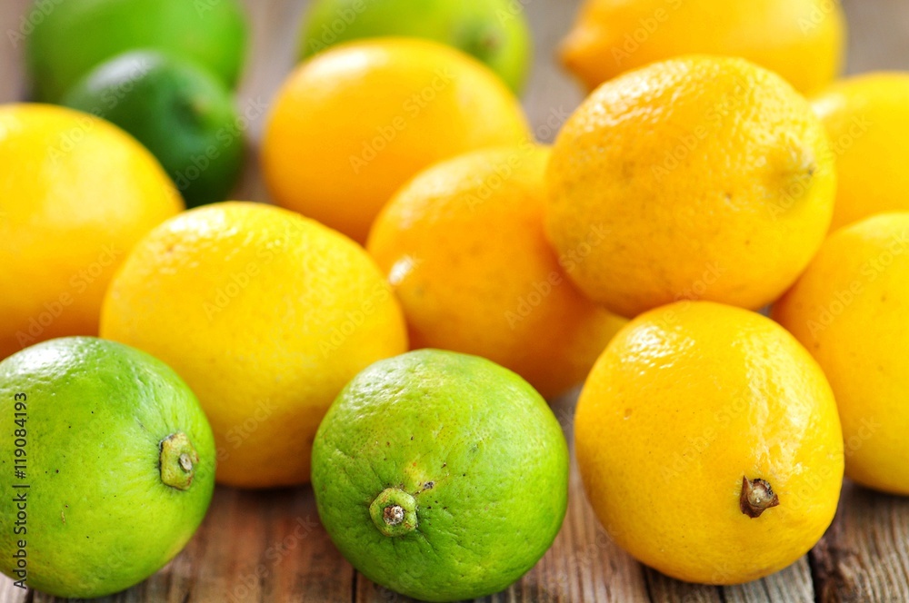 Organic lemons on a wooden background. Vintage style.