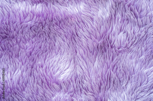 Closeup surface abstract fabric pattern at the purple fabric carpet at the floor of house texture background