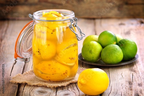 Preserved lemons with sea salt and spices. Moroccan cuisine. Vintage style.