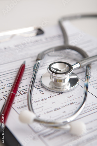 Medical concept with stethoscope on medical history form.