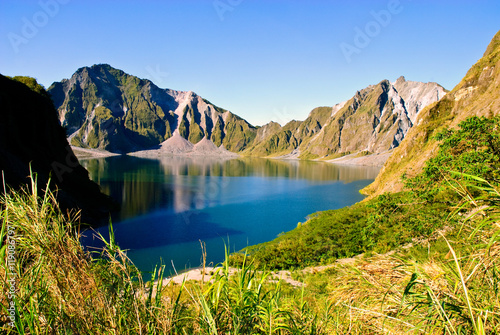 view of the crater lake of Mount Pinatubo volcano in Luzon, Philippines. The volcano erupted in July 1991, causing significant global environmental effects. photo