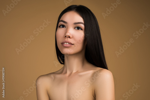 Beautiful Woman With Perfect Skin and Long Hair Beauty Studio Portrait