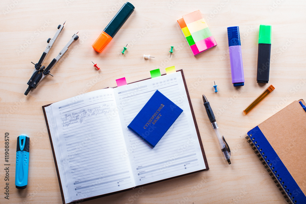 Desktop on which the drawing compasses, pencil and notebook Desktop on which the drawing compasses, pencil and notebook