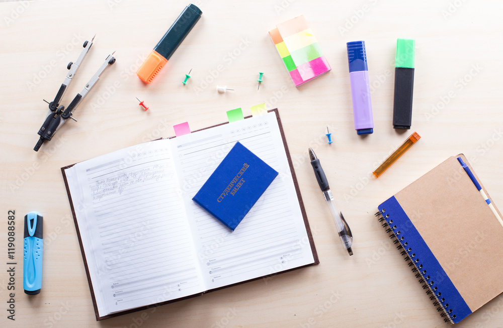 Desktop on which the drawing compasses, pencil and notebook Desktop on which the drawing compasses, pencil and notebook