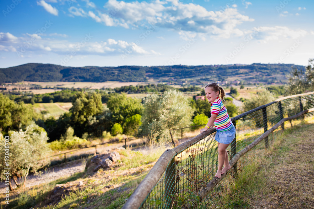 Little girl watching landscape in Italy
