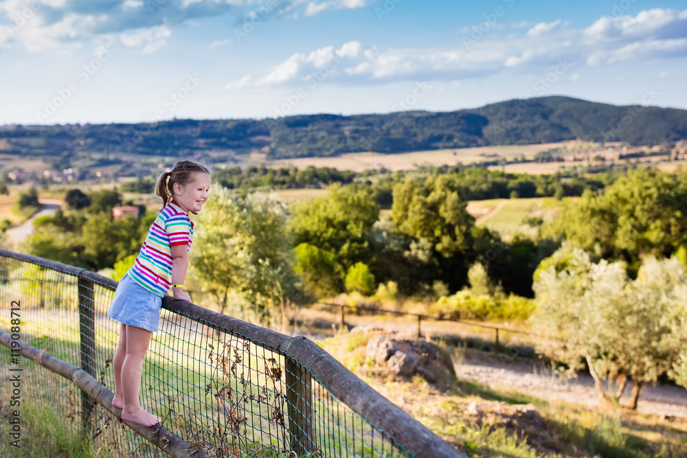 Little girl watching landscape in Italy