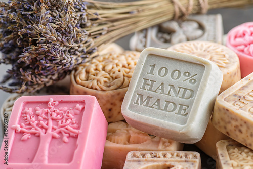 set of handmade soaps with lavender bunch, product of cosmetics and body care photo