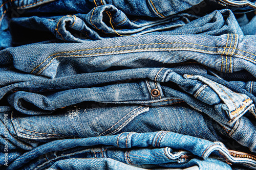 Stack of jeans, Background fashion .
