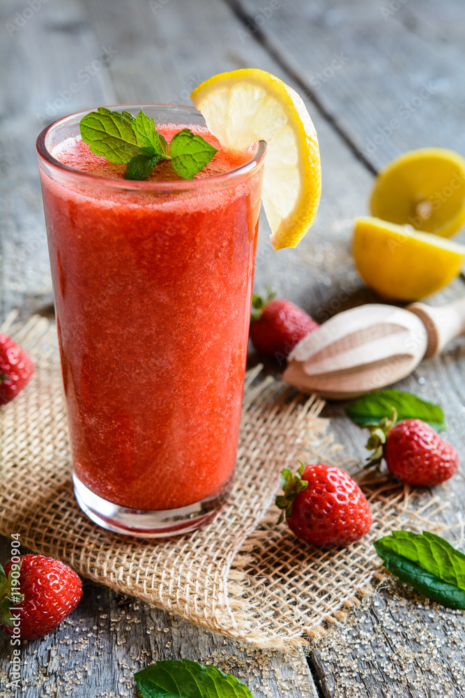 Refreshing strawberry smoothie with lemon juice in a glass jar Refreshing strawberry smoothie with lemon juice in a glass jar
