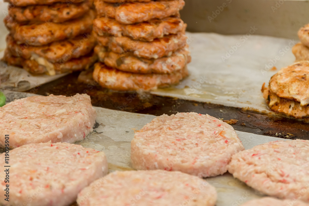 hamburgers and hotdogs cooking on grill outdoors hamburgers and hotdogs cooking on grill outdoors