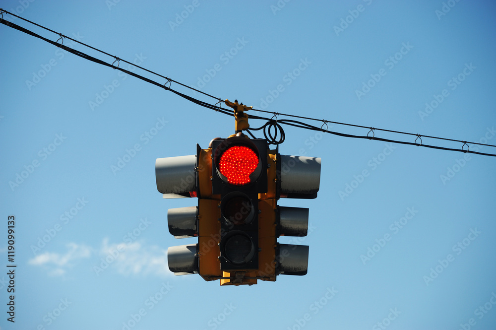 bygning definitive Suradam red traffic light hanging against sky Stock-Foto | Adobe Stock