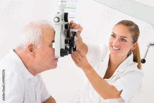 An Optometrist Doing Sight Testing For Patient