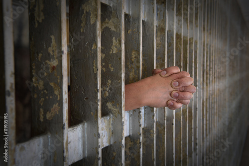 Hands of Prisoner Coming from Cell