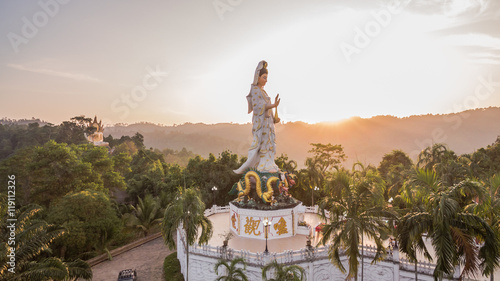 aerial photo by drone at wat Bangreang in PhangNga province.you can see Buddha with a naga on the  head  QuanYin and big pagoda on the hill top 
