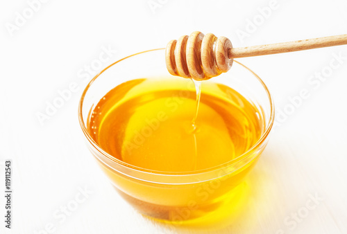 Honey in a bowl and dipper