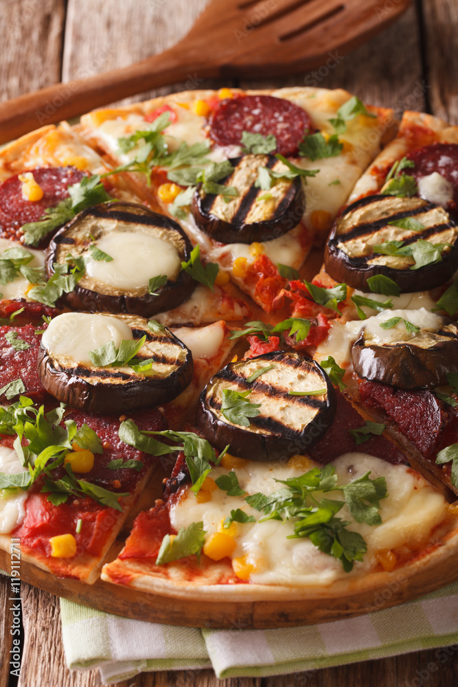 Italian pizza with eggplant, sausage, corn and cheese macro on a board. vertical
Italian pizza with eggplant, sausage, corn and cheese macro on a board. vertical