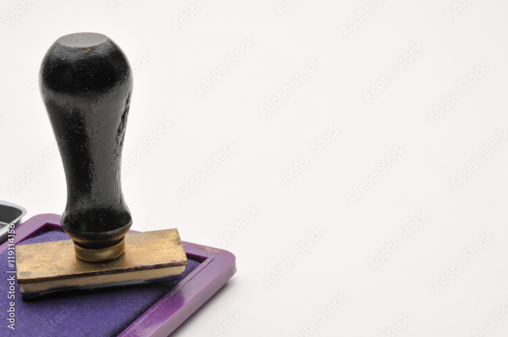 blue Ink pad & wooden rubber stamp with copy space on the stamp. blue Ink pad & wooden rubber stamp with copy space on the stamp.
