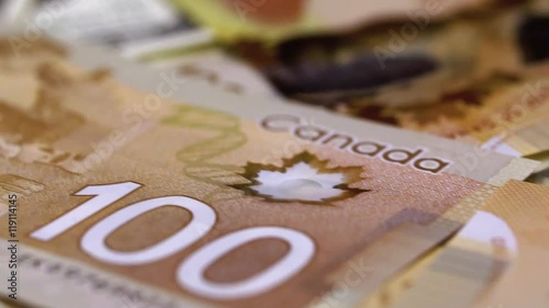 Many Canadian 100 bills, polymer plastic type. Slider macro shooting.