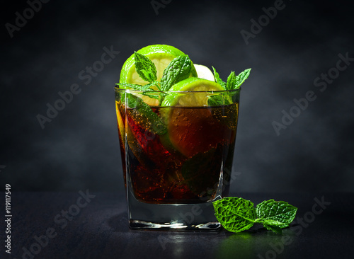  cocktail Cuba libre with lime and peppermint leaves photo
