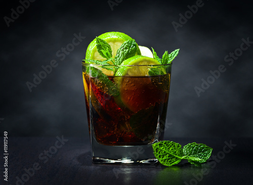 cocktail Cuba libre with lime and peppermint leaves